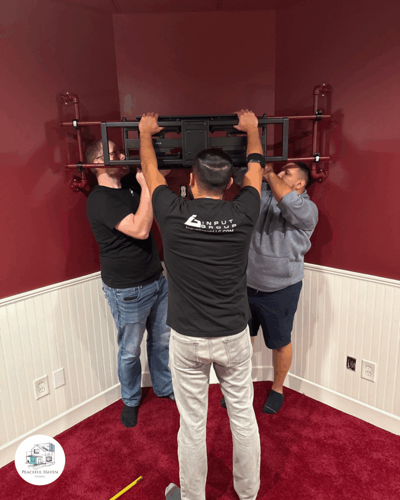 TV wall bracket with industrial pipe support system Signal Mountain
