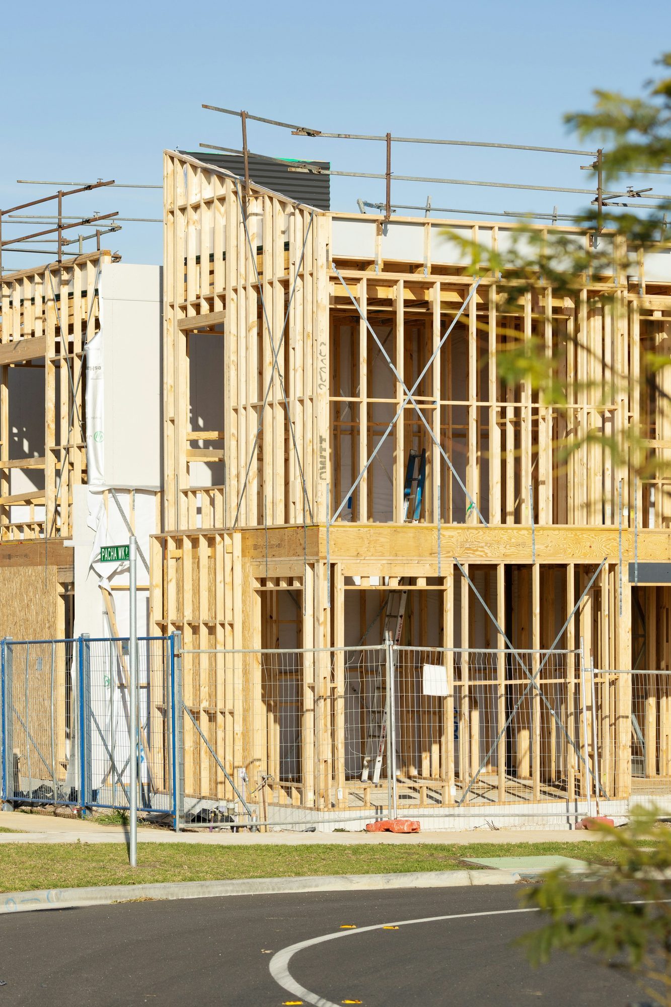 New house under construction with exposed wood framing