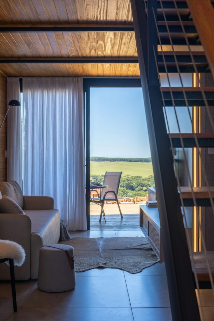 Floor-to-ceiling sliding glass with a wooded view