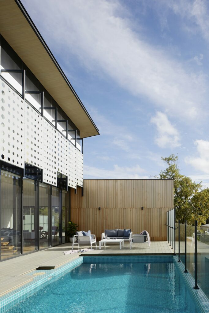 Modern living space with large windows and outdoor living