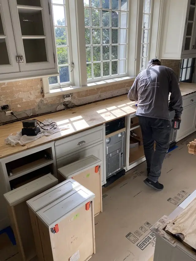 Lower cabinet installation with floors protected