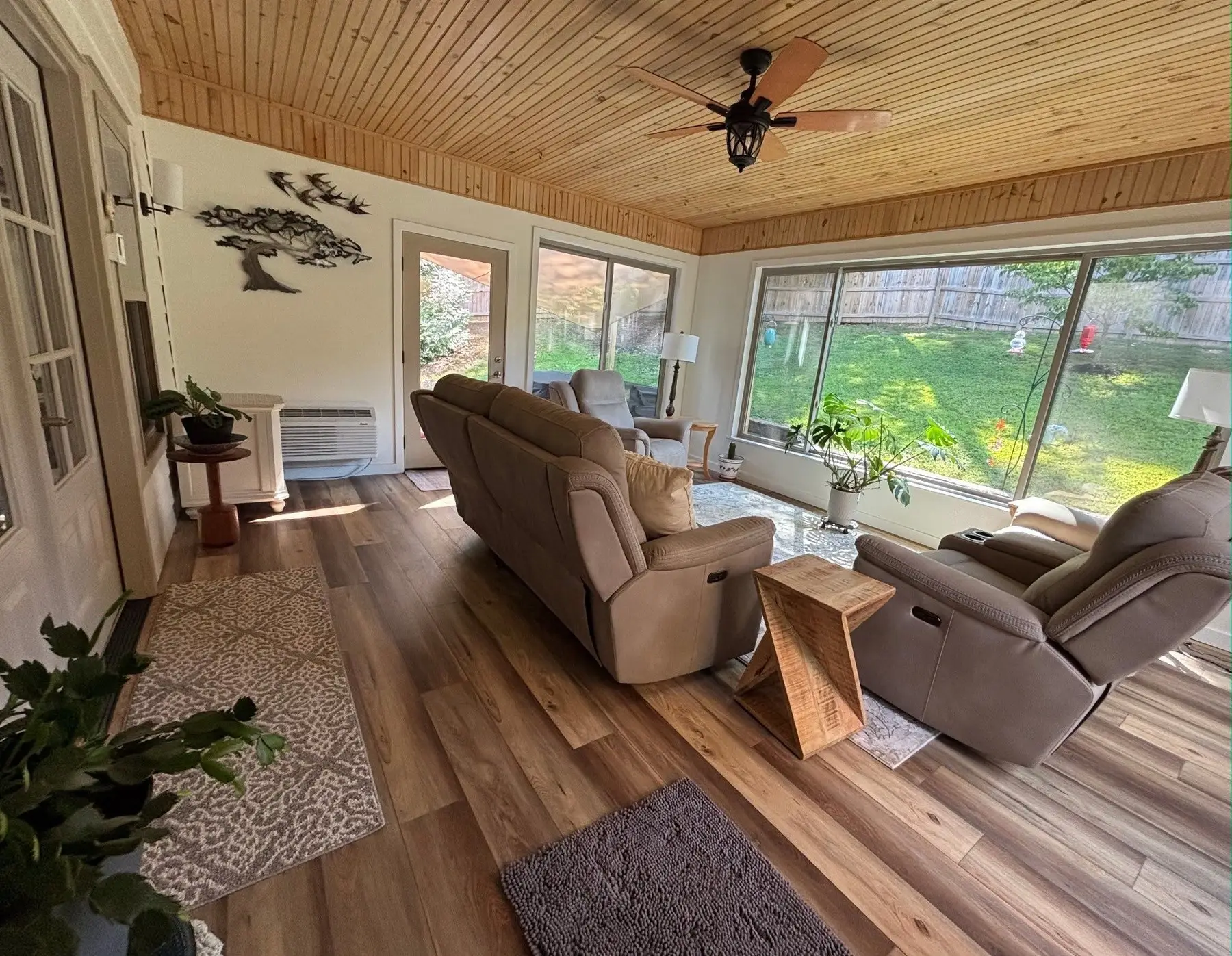 Four-season porch interior with windows on three sides