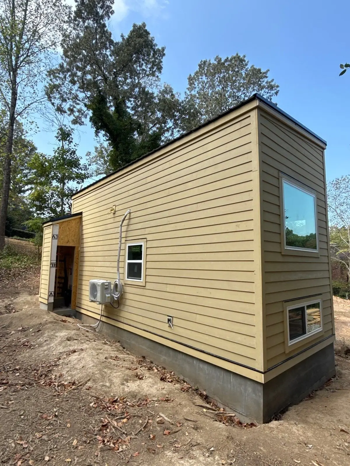 Tiny house side exterior with large windows