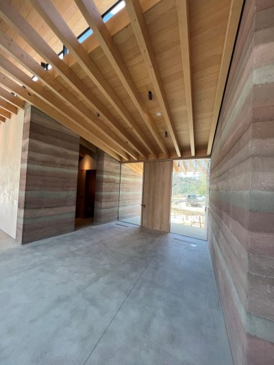 Custom Framed Wood Beams and Rammed Earth